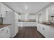 Bright kitchen featuring white cabinets, granite countertops, and stainless steel sink at 719 Se 24Th St, Ocala, FL 34471