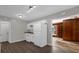 Efficient kitchen features classic white appliances and white cabinets, seamlessly connected to the living area at 719 Se 24Th St, Ocala, FL 34471