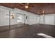 Expansive living area with wood ceiling, an adjoining kitchen, and ample natural light at 719 Se 24Th St, Ocala, FL 34471
