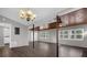 Spacious living room with wood ceiling, modern ceiling fans, and large windows at 719 Se 24Th St, Ocala, FL 34471