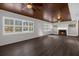 Bright living area with wood ceiling, modern ceiling fans, and fireplace at 719 Se 24Th St, Ocala, FL 34471