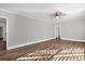 Open living room with new flooring, neutral paint, ceiling fan, and natural light at 719 Se 24Th St, Ocala, FL 34471