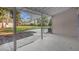 Outdoor patio showcasing a spacious backyard and mature landscaping, perfect for outdoor entertaining at 719 Se 24Th St, Ocala, FL 34471