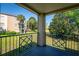 Relaxing balcony view overlooking lush landscaping and tropical palm trees at 7230 Westpointe Blvd # 1222, Orlando, FL 32835
