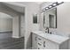 Bathroom with a white vanity, white marble countertop, and contemporary light fixture at 7230 Westpointe Blvd # 1222, Orlando, FL 32835
