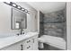 Inviting bathroom with a bright vanity, modern fixtures, and tiled shower over tub at 7230 Westpointe Blvd # 1222, Orlando, FL 32835