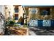 Inviting condo exterior with garages, balconies, and well-maintained landscaping around the building at 7230 Westpointe Blvd # 1222, Orlando, FL 32835