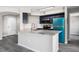 Modern kitchen features an island with granite countertops and new stainless steel appliances at 7230 Westpointe Blvd # 1222, Orlando, FL 32835