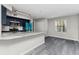 Open-concept kitchen features an island with granite countertops and new stainless steel appliances at 7230 Westpointe Blvd # 1222, Orlando, FL 32835