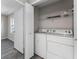 Convenient laundry room with washer, dryer, and ample storage space in the unit at 7230 Westpointe Blvd # 1222, Orlando, FL 32835