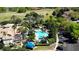 Resort style pool surrounded by palm trees and landscaping at 7230 Westpointe Blvd # 1222, Orlando, FL 32835