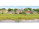 Aerial view of homes with backyard pond at 750 Sterling Spring Rd, Orlando, FL 32828