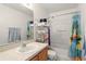 Bathroom with white vanity, mirror, toilet and combination tub and shower at 750 Sterling Spring Rd, Orlando, FL 32828