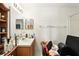 Bathroom with a wood vanity, sink, mirror, toilet and open shelving unit at 750 Sterling Spring Rd, Orlando, FL 32828