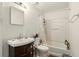 Bathroom featuring a dark wood vanity with a white sink and a shower/tub combo at 750 Sterling Spring Rd, Orlando, FL 32828