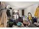 Bedroom with cluttered items and shelving unit at 750 Sterling Spring Rd, Orlando, FL 32828