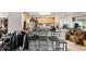 Eat-in kitchen with wood cabinets, light countertops, stainless steel appliances, and tiled floors at 750 Sterling Spring Rd, Orlando, FL 32828