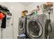 Laundry room featuring large capacity washer and dryer at 750 Sterling Spring Rd, Orlando, FL 32828