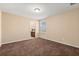 Bedroom featuring neutral carpeting, a window for natural light, and easy access to the bathroom at 778 Gainer Way, Winter Springs, FL 32708