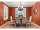 Elegant dining room featuring tile floors, shuttered windows, and a decorative chandelier at 778 Gainer Way, Winter Springs, FL 32708