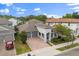 Beautiful two-story home with a brick driveway, a three-car garage, and a charming front porch at 778 Gainer Way, Winter Springs, FL 32708