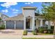Beautiful single-Gathering home featuring a brick driveway, landscaped yard, and a gray two-car garage at 778 Gainer Way, Winter Springs, FL 32708