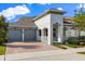 Attractive single-Gathering home with a brick driveway, a two-car garage and landscaped yard at 778 Gainer Way, Winter Springs, FL 32708