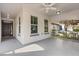 Inviting covered front porch with ceiling fan, gray painted floor and white trim at 778 Gainer Way, Winter Springs, FL 32708