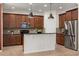 Kitchen with stainless steel appliances, granite countertops, tile backsplash, and overhead pendant lighting at 778 Gainer Way, Winter Springs, FL 32708