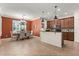 Open kitchen and dining area featuring tile floors, modern cabinetry, and a large window at 778 Gainer Way, Winter Springs, FL 32708