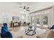 Bright and airy living room with tile floors, French doors, and comfortable seating at 778 Gainer Way, Winter Springs, FL 32708