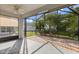 Spacious screened-in patio with a ceiling fan, offering a relaxing outdoor living space with a backyard view at 778 Gainer Way, Winter Springs, FL 32708