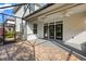 Covered brick patio with dual ceiling fans and access to the home via elegant French doors at 778 Gainer Way, Winter Springs, FL 32708