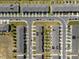 Aerial view of modern townhomes with private driveways and well maintained landscaping in a friendly community at 808 Grandin St, Davenport, FL 33837
