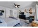 Inviting bedroom with decor and seating with a dresser and comfortable chair at 808 Grandin St, Davenport, FL 33837