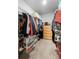 Walk-in closet with racks, shelves, and clear boxes for organization and storage space at 808 Grandin St, Davenport, FL 33837