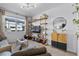 Bright living room with a large window and stylish shelving at 808 Grandin St, Davenport, FL 33837