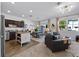Open floor plan with a combined living and dining area, featuring stainless steel appliances at 808 Grandin St, Davenport, FL 33837