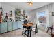 Home office with a wooden desk, blue cabinets, and natural light, perfect for productivity at 808 Grandin St, Davenport, FL 33837