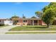 Charming single-story home featuring a well-maintained lawn and a welcoming entrance at 825 Keats Ave, Orlando, FL 32809