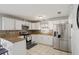 Well-equipped kitchen with granite countertops, stainless steel appliances, and white cabinets at 825 Keats Ave, Orlando, FL 32809