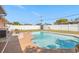 Backyard featuring a private pool, patio, white fence and green grass at 825 Keats Ave, Orlando, FL 32809