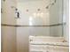 Elegant walk-in shower featuring dual showerheads and custom tile work at 825 Keats Ave, Orlando, FL 32809
