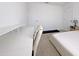 Minimalist bedroom with neutral carpet, desk and dual doors at 827 Dennis Ave, Orlando, FL 32807