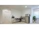 Bright, versatile bonus room with natural light, a workstation, mini fridge, and neutral decor to serve as an office at 827 Dennis Ave, Orlando, FL 32807