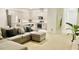 Bright open-concept living space flows seamlessly into a modern kitchen area and entry at 827 Dennis Ave, Orlando, FL 32807