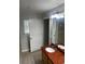 Bathroom with granite vanity, single sink and white cabinets at 831 N Fern Creek Ave # 101, Orlando, FL 32803