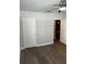 Cozy bedroom with hardwood floors, a ceiling fan, and ample closet space at 831 N Fern Creek Ave # 101, Orlando, FL 32803