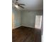 Bedroom featuring modern ceiling fan, and door opening to tiled shower at 831 N Fern Creek Ave # 101, Orlando, FL 32803
