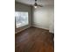 Bedroom with wood-look floors, ceiling fan, natural light and a white interior door at 831 N Fern Creek Ave # 101, Orlando, FL 32803